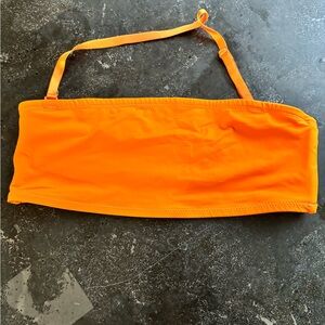 Bright Orange Bandeau Top skims swim